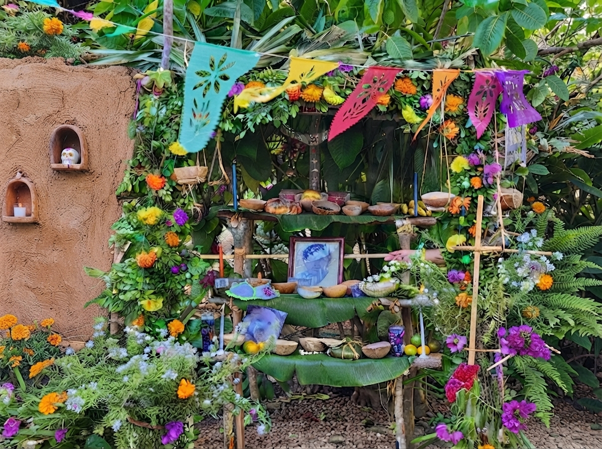Altar tradicional de Hanal Pixán con alimentos, velas, flores, agua, incienso y fotografías